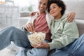 Blurred african american couple with popcorn