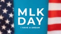 Blurred American Flag With Abbreviation MLK. Happy Martin Luther King Day Concept