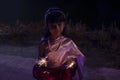 Blurred of Asian little girl wearing traditional costume thai style holding sparkler playing for fun. Royalty Free Stock Photo