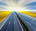 Blurred asphalt road and blue sky Royalty Free Stock Photo