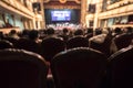 Blurred Audience in a theater, on a concert. Viewers watching the show Royalty Free Stock Photo