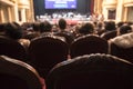 Blurred Audience in a theater, on a concert. Viewers watching the show. Royalty Free Stock Photo