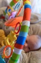 Blurred Baby Actively Playing In Her Rainbow Playground