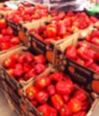 Blurred background with Fresh pods of red peppers i supermarket store. Close up. Blur bokeh lights. Abstract blurred supermarket s Royalty Free Stock Photo