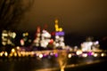 Blurred background of bright view on the night city and skyscraper.