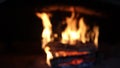 Blurred background of burning wood in the fireplace.