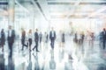 Blurred background of business people and activities inside an office building. The image captures the fast-paced and busy