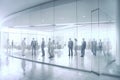 Blurred background of business people and activities inside an office building. The image captures the fast-paced and busy