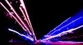 Blurred background with Cars light trails on a curved highway at night. Night traffic trails. Motion blur. Night city road with tr Royalty Free Stock Photo