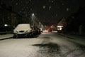 Blurred background. City view, lights, falling snow, night, street, bokeh spots moving cars winter scenery Lantern light Royalty Free Stock Photo