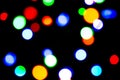 Blurred background with colorful bokeh lights on dark purple and blue background/blurred Christmas lights Royalty Free Stock Photo