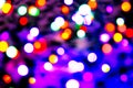 Blurred background with colorful bokeh lights on dark purple and blue background/blurred Christmas lights Royalty Free Stock Photo