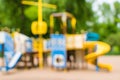 Blurred background with colorful playground in the public park. Royalty Free Stock Photo