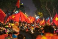 Blurred background of crowd of Vietnamese football fans down the street to celebrate the win after soccer, with a lot of Vietnames