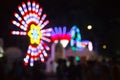 Blurred Background of Decorating Colorful Light Bulbs of Ferris wheel in amusement theme festival. Fun Park, Amusement Park, Royalty Free Stock Photo