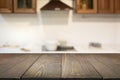 Blurred background. Empty wooden tabletop and defocused modern kitchen for display or montage your products. Royalty Free Stock Photo