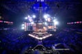 Blurred background of an esports event - Big illuminated main stage of a computer games tournament located on a big