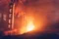 Blurred background of fire in interior of industrial factory, abstract defocused burning building inside at night