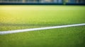 Blurred background of a green playing field with a white horizontal boundary line Royalty Free Stock Photo