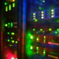 Blurred background of internet service provider server equipment, bokeh of lights of computers and network routers Royalty Free Stock Photo