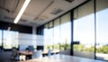 Blurred Background of a Light Modern Office with Panoramic Windows and Beautiful Lighting