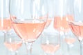 blurred background of many different glasses with rose wine Royalty Free Stock Photo