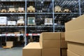 Many items inside cardboard boxes on warehouse storage shelves Royalty Free Stock Photo