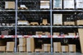 Many items inside cardboard boxes on warehouse storage shelves Royalty Free Stock Photo