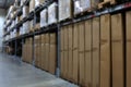 Many items inside cardboard boxes on warehouse storage shelves Royalty Free Stock Photo