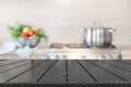 Blurred background. Modern kitchen with empty wooden tabletop and space for you. Royalty Free Stock Photo