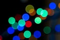 Blurred background multicolored bokeh lights on a black background