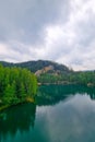 Blurred background, out of focus. View from a height of a mountain lake in the forest. Royalty Free Stock Photo