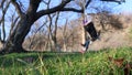 Lonely girl on a swing in the park on a sunny day Royalty Free Stock Photo