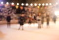 Blurred background of people skating on the ice rink