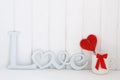 Blurred background romantic wooden letters love candy heart