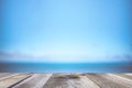 Blurred background of sea coast and old table of wood
