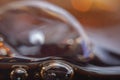 Blurred background in soft focus with the top line of cola in a glass and bubbles Royalty Free Stock Photo