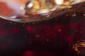 Blurred background in soft focus with the top line of soft drink in a glass and bubbles Royalty Free Stock Photo