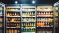 Blurred background of supermarket fridge with bottles of beverages on shelves. Glass showcase Royalty Free Stock Photo