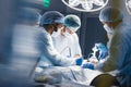 Blurred background with team surgeon at work in operating room