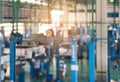 Blurred background of technician repairing the car in garage,mechanics fixing in a workshop suspension detail of lifted automobile Royalty Free Stock Photo