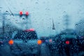 Blurred background of traffic jam on rainy day at crossroad junction street in Bangkok with many red light, Selective focus on ra Royalty Free Stock Photo