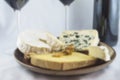 Blurred background of various cheeses