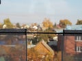 Blurred background. View from the train window on roadside buildings with an autumn forest. Russian open spaces Royalty Free Stock Photo