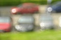 Blurred background with vintage bokeh bubble balls, shot with a vintage lens.Line of cars in a street, free copy space