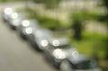 Blurred background with vintage bokeh bubble balls, shot with a vintage lens.Line of cars in a street, free copy space
