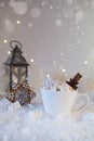 Blurred background of winter frost and Christmas chocolate spice beverage