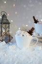 Blurred background of winter frost and Christmas chocolate spice beverage with cookies