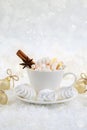 Blurred background of winter frost and Christmas chocolate spice beverage with sweets