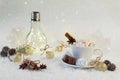 Blurred background of winter frost and Christmas chocolate spice beverage with sweets in cups
